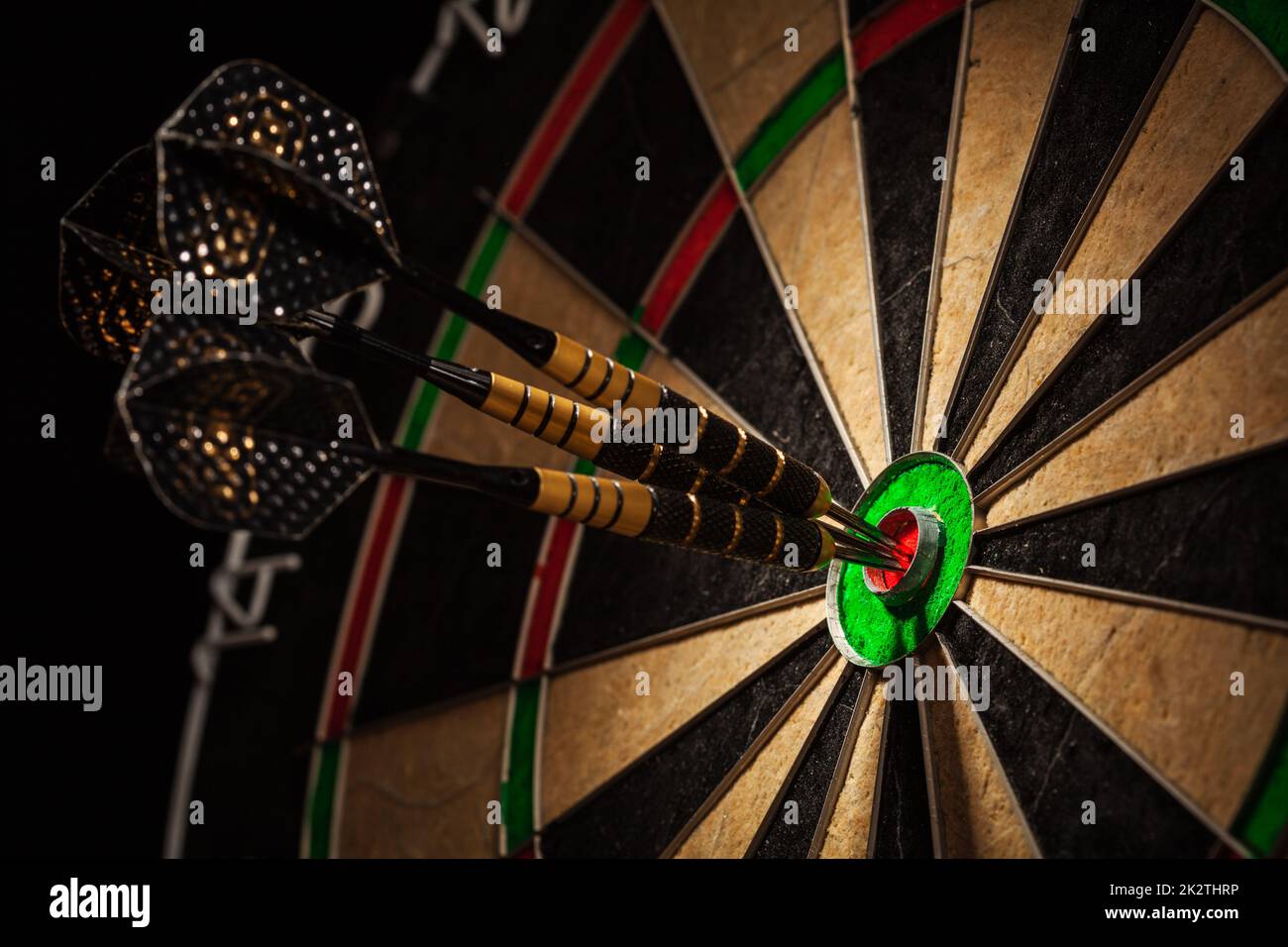 Three darts in bull's eye close up Stock Photo Alamy