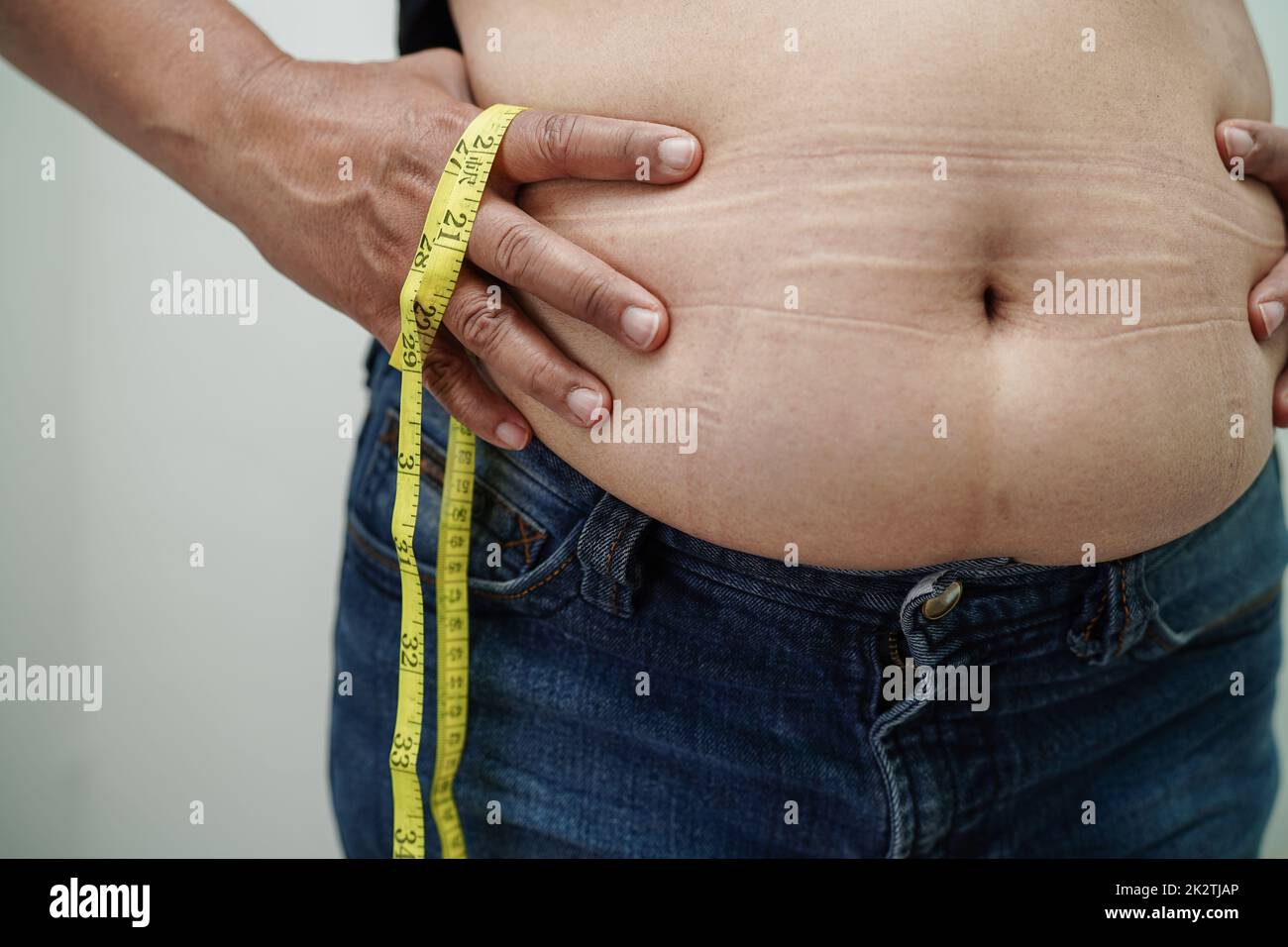 Person tape measure waist fat hi-res stock photography and images - Page 2  - Alamy