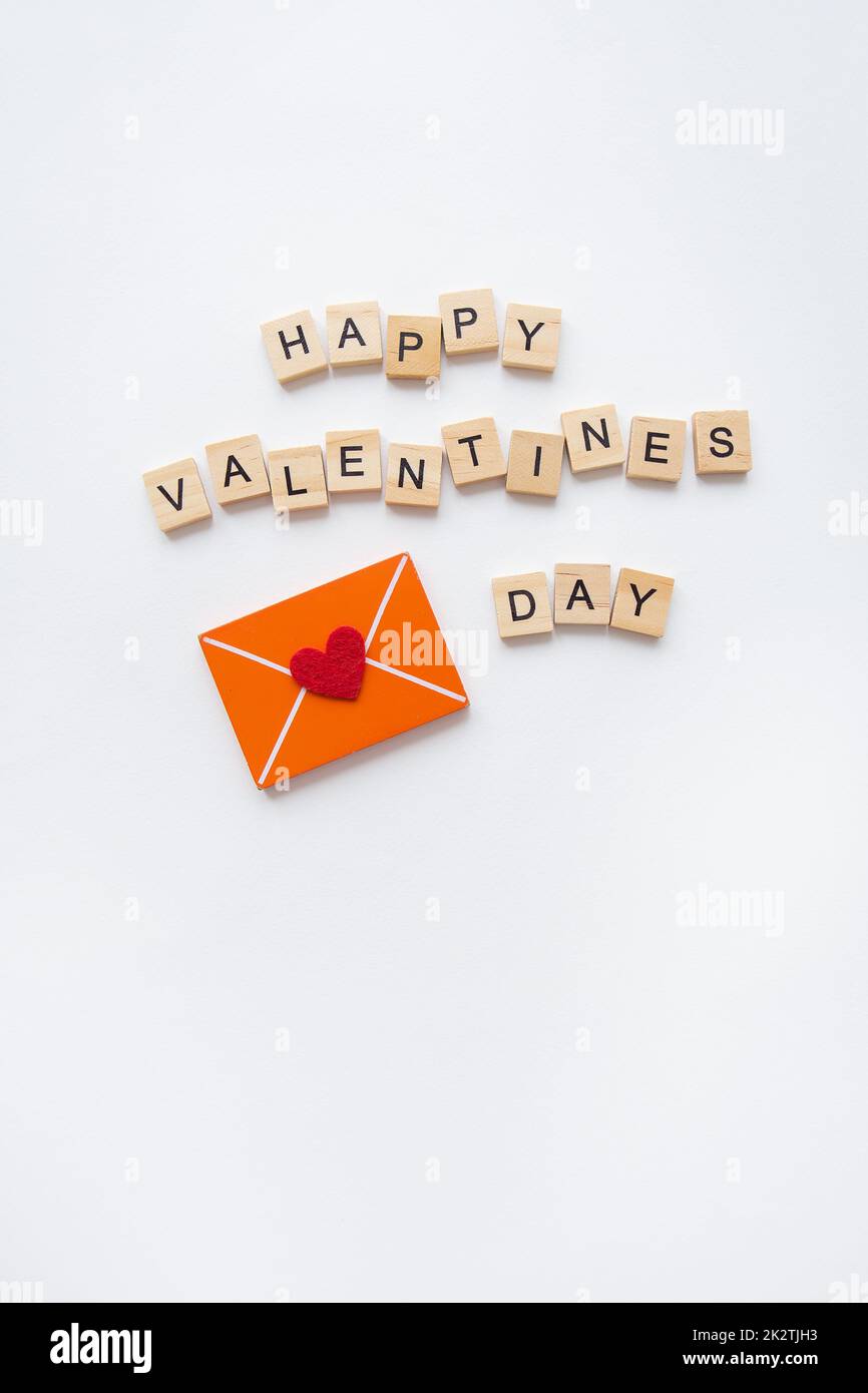 Love letter, red heart, wood lettering Happy Valentine's Day. Valentine's Day celebration concept. Stock Photo