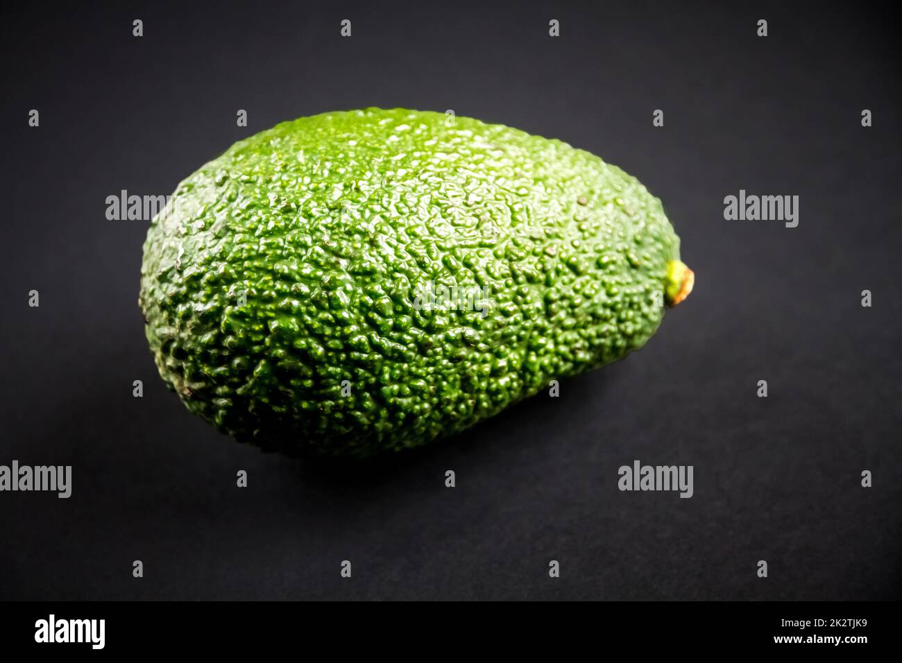 Avocado isolated on a black background Stock Photo