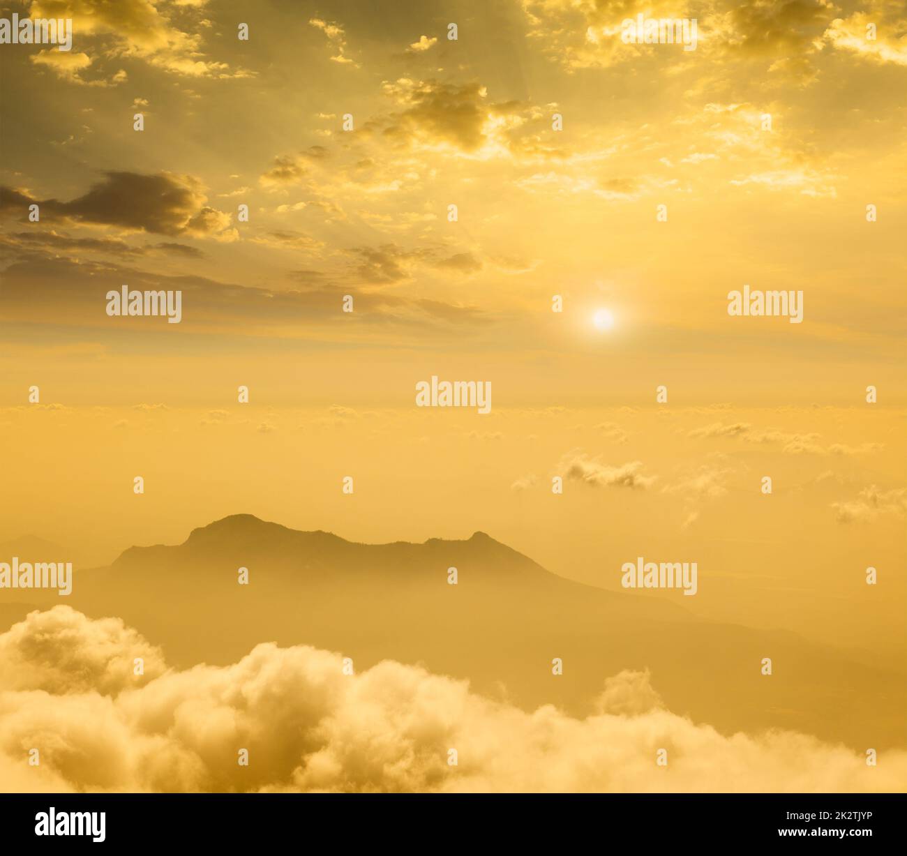 Mountains in cloud on sunset Stock Photo