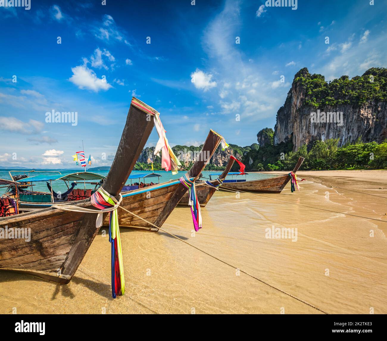 Long tail boats on beach, Thailand Stock Photo
