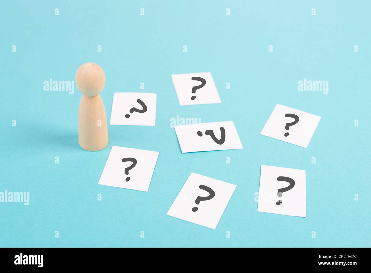 Man is thinking, question marks, brainstorming and looking for answers, solving a problem, making a decision, business and education concept Stock Photo