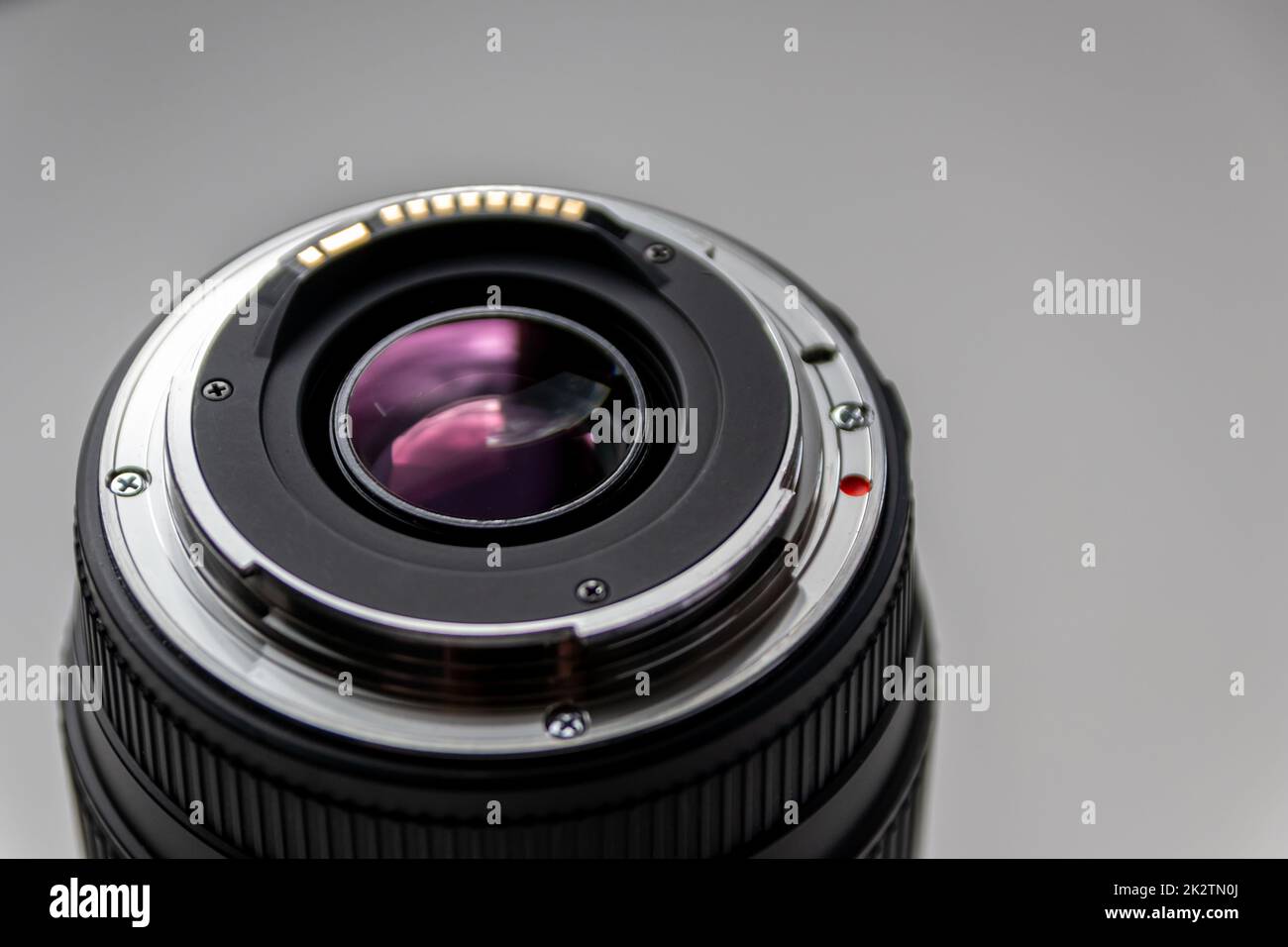 Back side of a dslr camera lens objective for professional photography with camera mount details in macro view with beautiful lens details for optical precision in portrait photography Stock Photo
