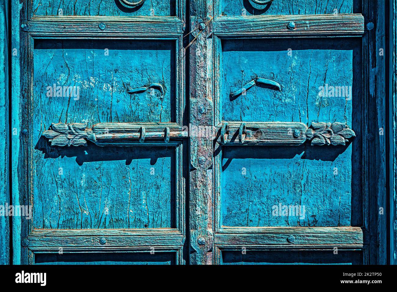 Latch with padlock on door in India Stock Photo