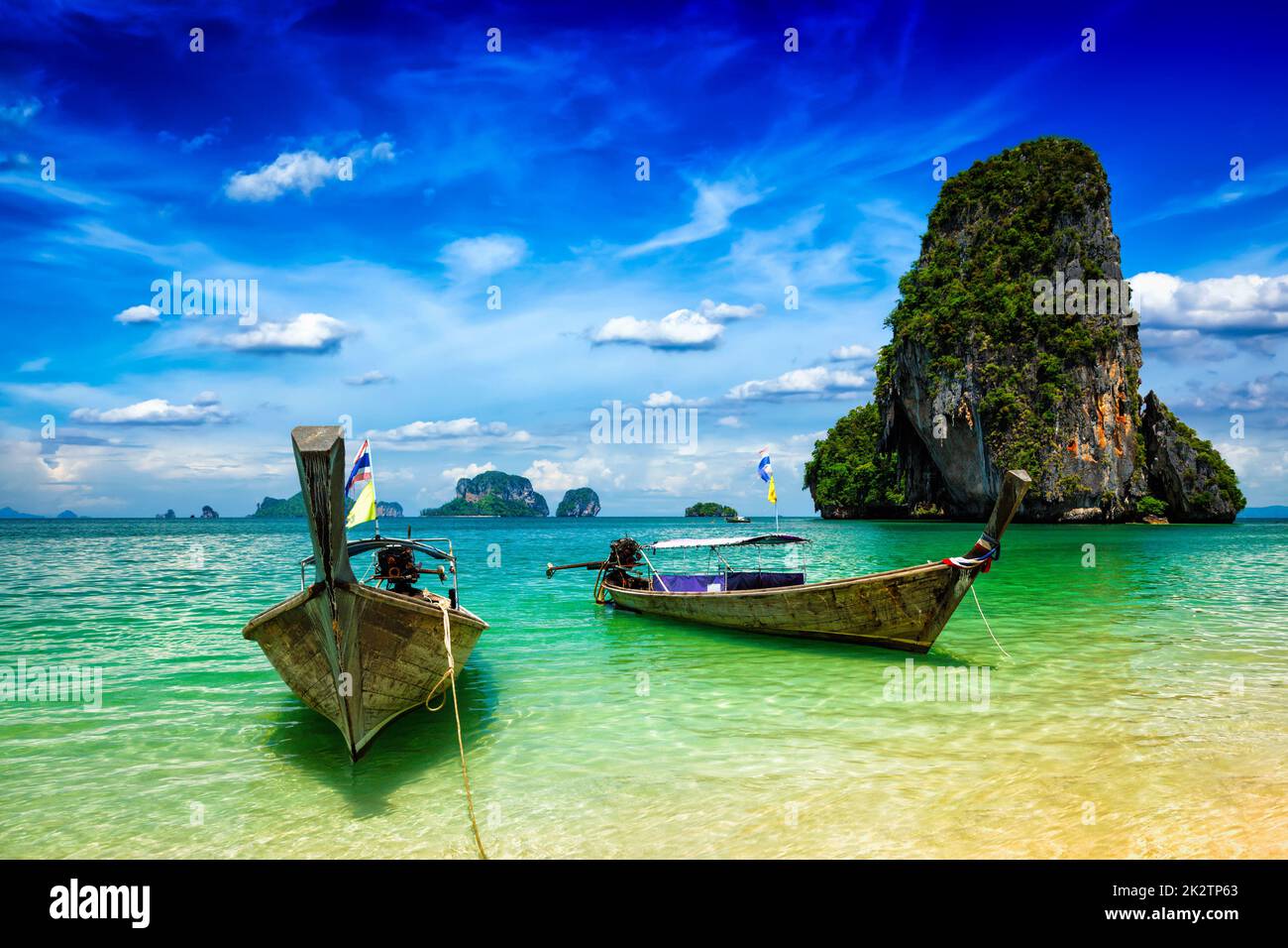 Long tail boats on beach, Thailand Stock Photo