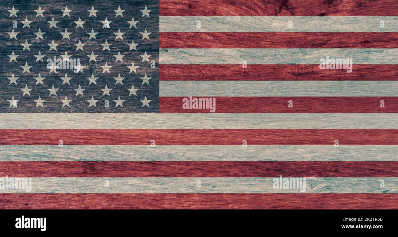 American flag on wooden background. National flag of the United States of America. 4th of July background. The Stars and Stripes. The Star-Spangled Banner. USA flag emblem. National symbol and ensign. Stock Photo