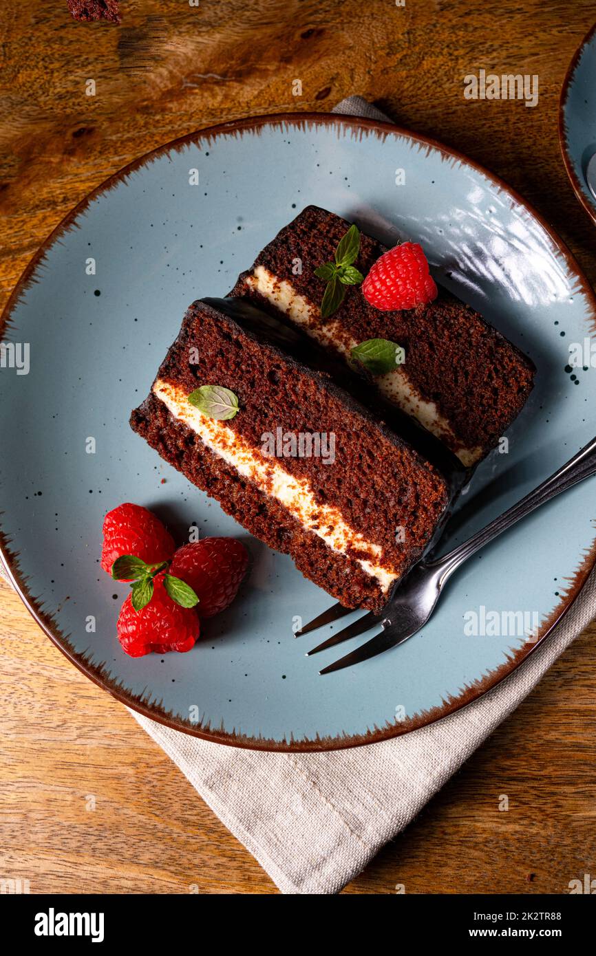 Rustic chocolate cake with raspberries and coffee Stock Photo