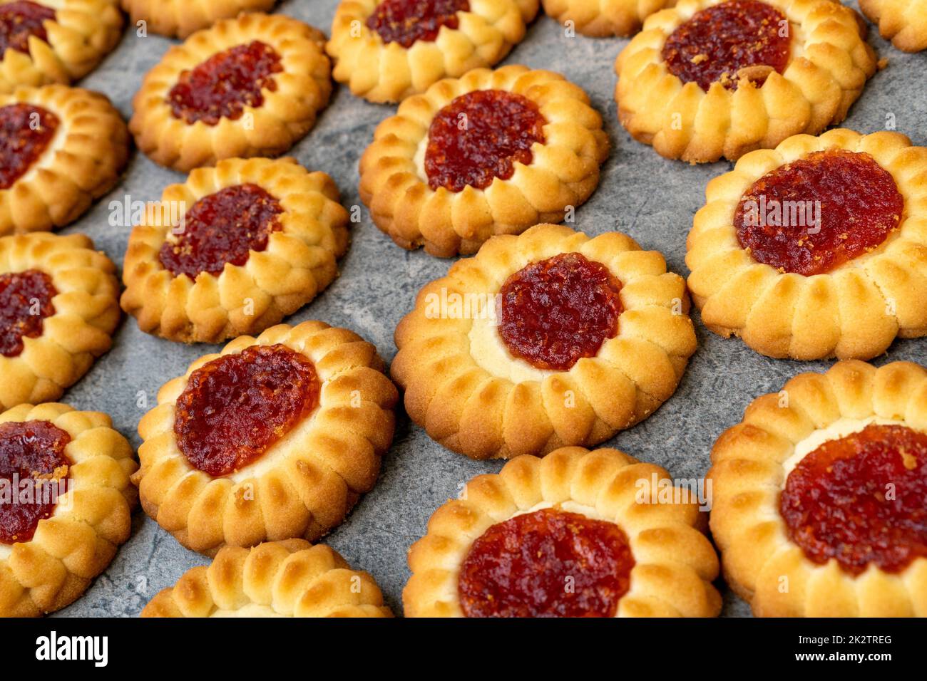 Baking cookies with a jam center Stock Photo Alamy