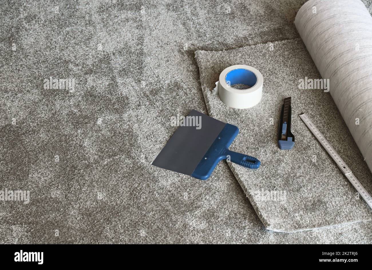 Laying of a new carpet Stock Photo Alamy