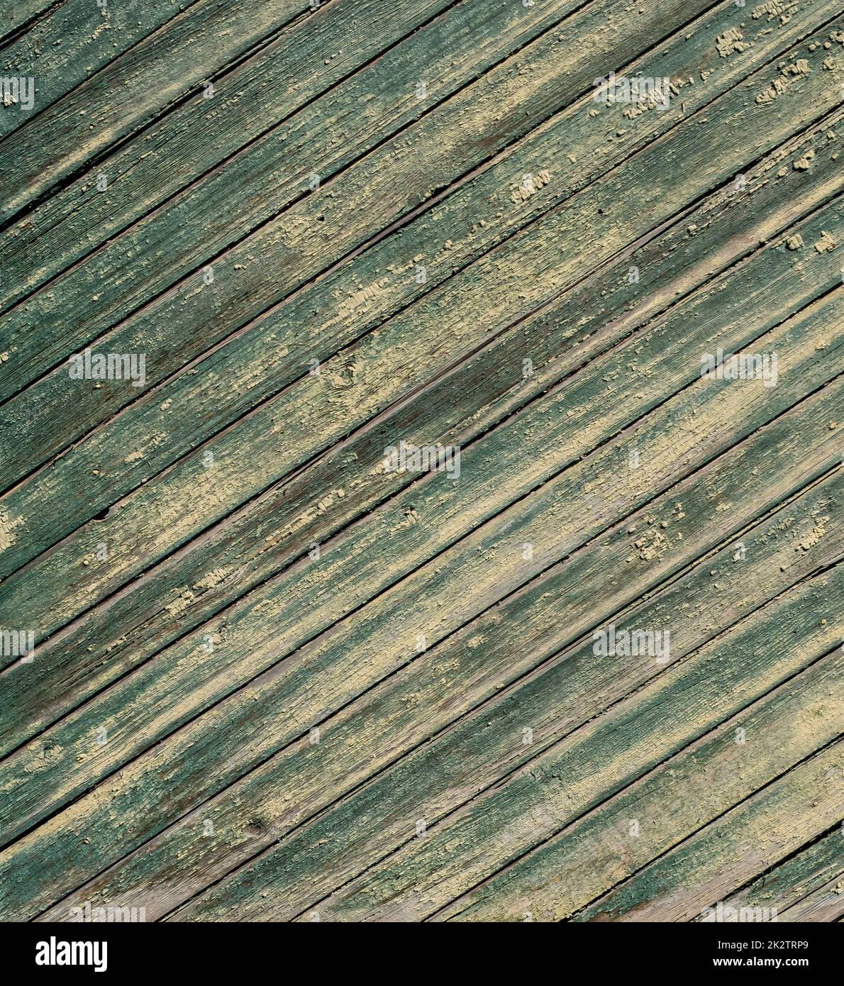 An old wooden diagonal plank wall brown and green Stock Photo