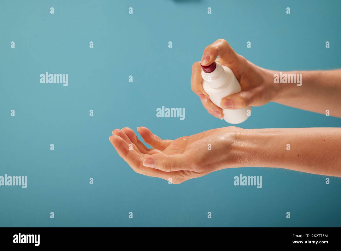 Crop woman spraying sanitizer on hand Stock Photo Alamy