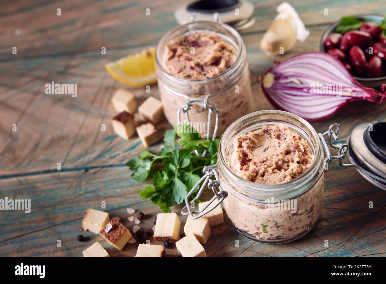 Fresh ingredient and jars of homemade vegetarian liverwurst pate on