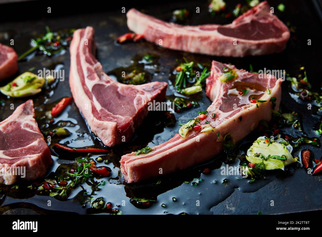Raw lamb chops in oil Stock Photo Alamy