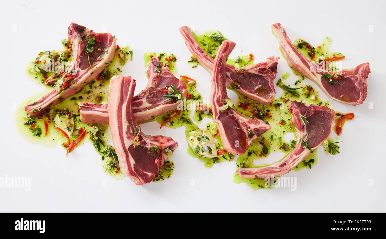 Uncooked lamb chops in marinate Stock Photo Alamy