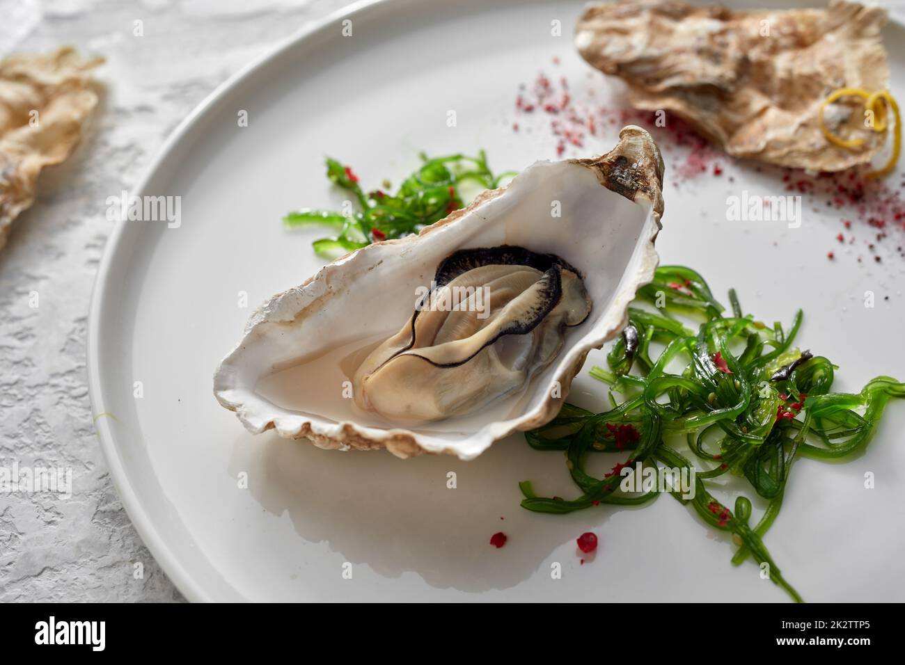 Gourmet oyster with Japanese wakame salad Stock Photo