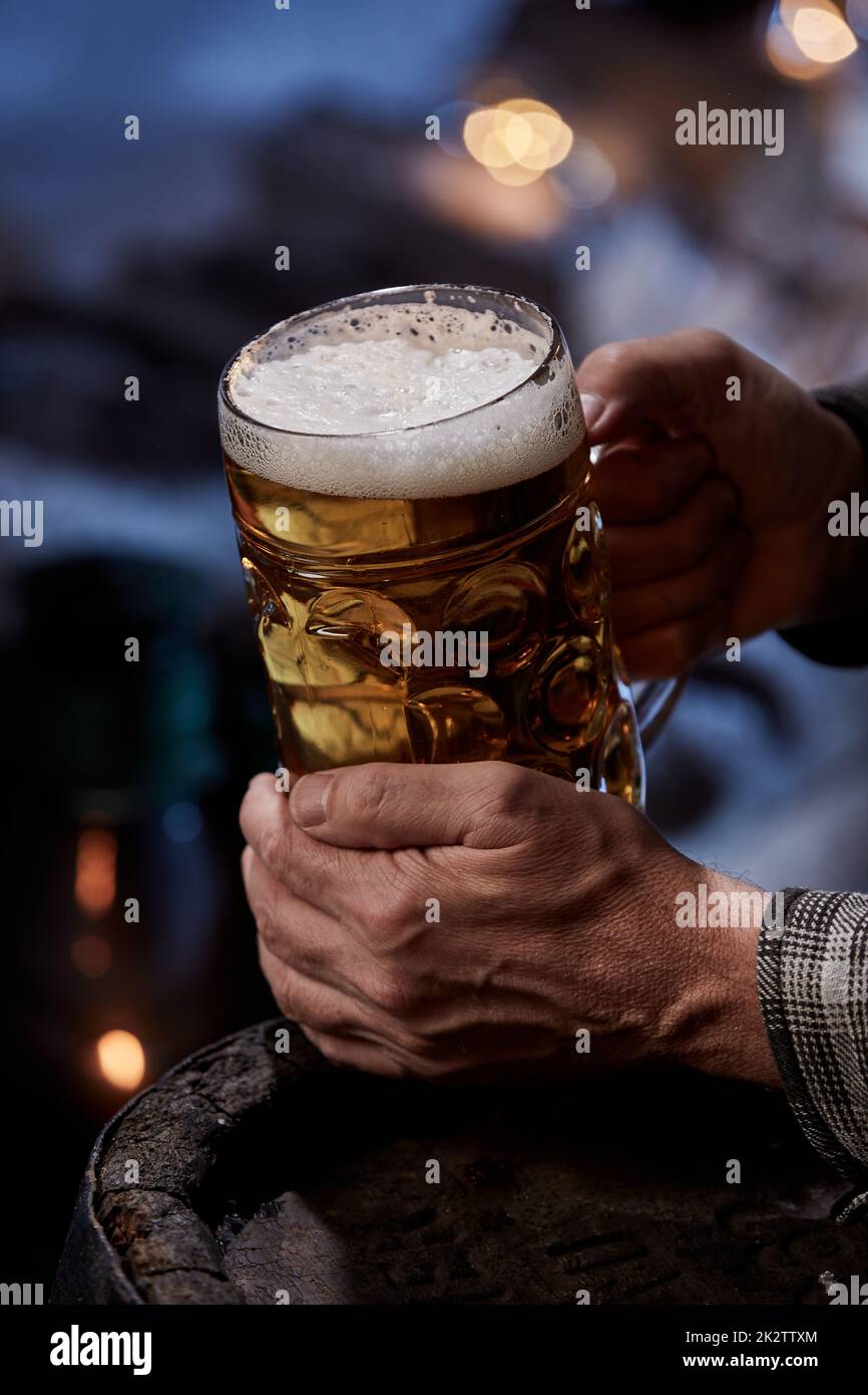 Man with jar of beer in night Stock Photo