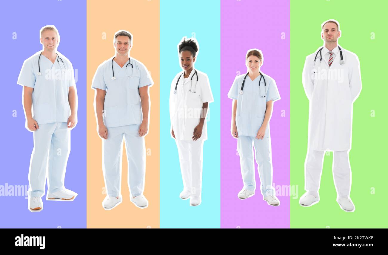 Full length portrait of confident multiethnic medical team standing in row against white background Stock Photo