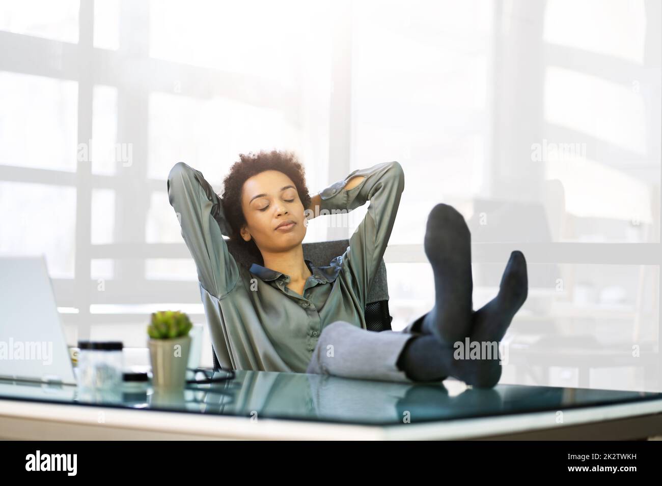 One woman sitting chair eyes closed hi-res stock photography and images ...