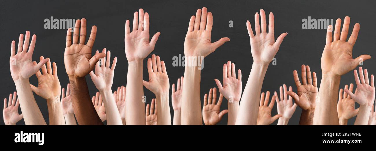 Close-up Of Raised Hands Stock Photo