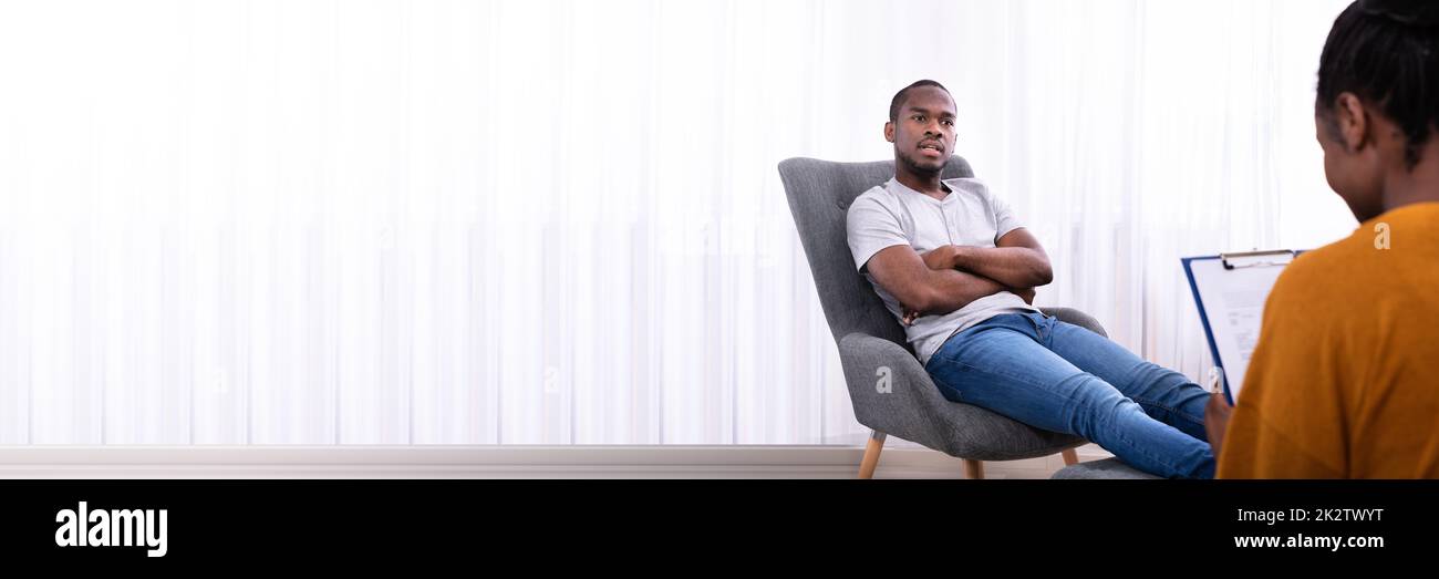Man sitting on chair listening hi-res stock photography and images - Alamy