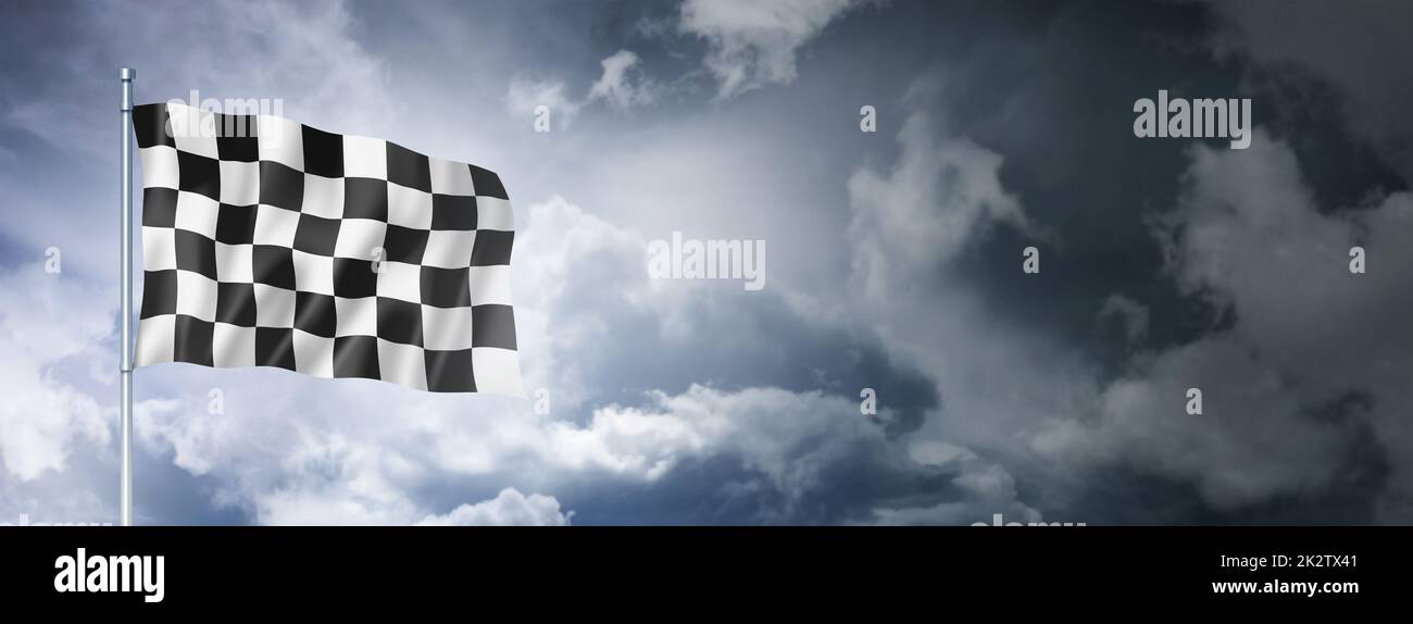Auto racing finish checkered flag on a cloudy sky Stock Photo