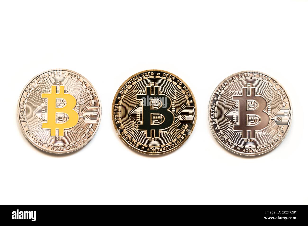 Close up shot of silver and gold bitcoin digital cryptocurrency coins, on white. Stock Photo