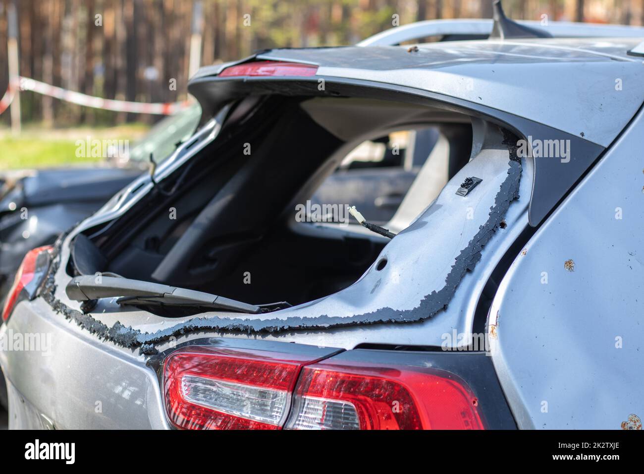 A car after an accident with a broken rear window. Broken window in a