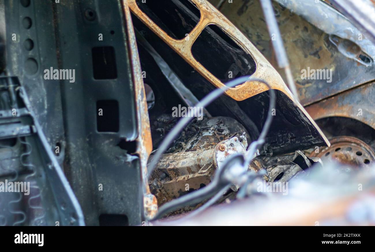 The car was completely destroyed by fire. Abandoned, burnt and rusty ...