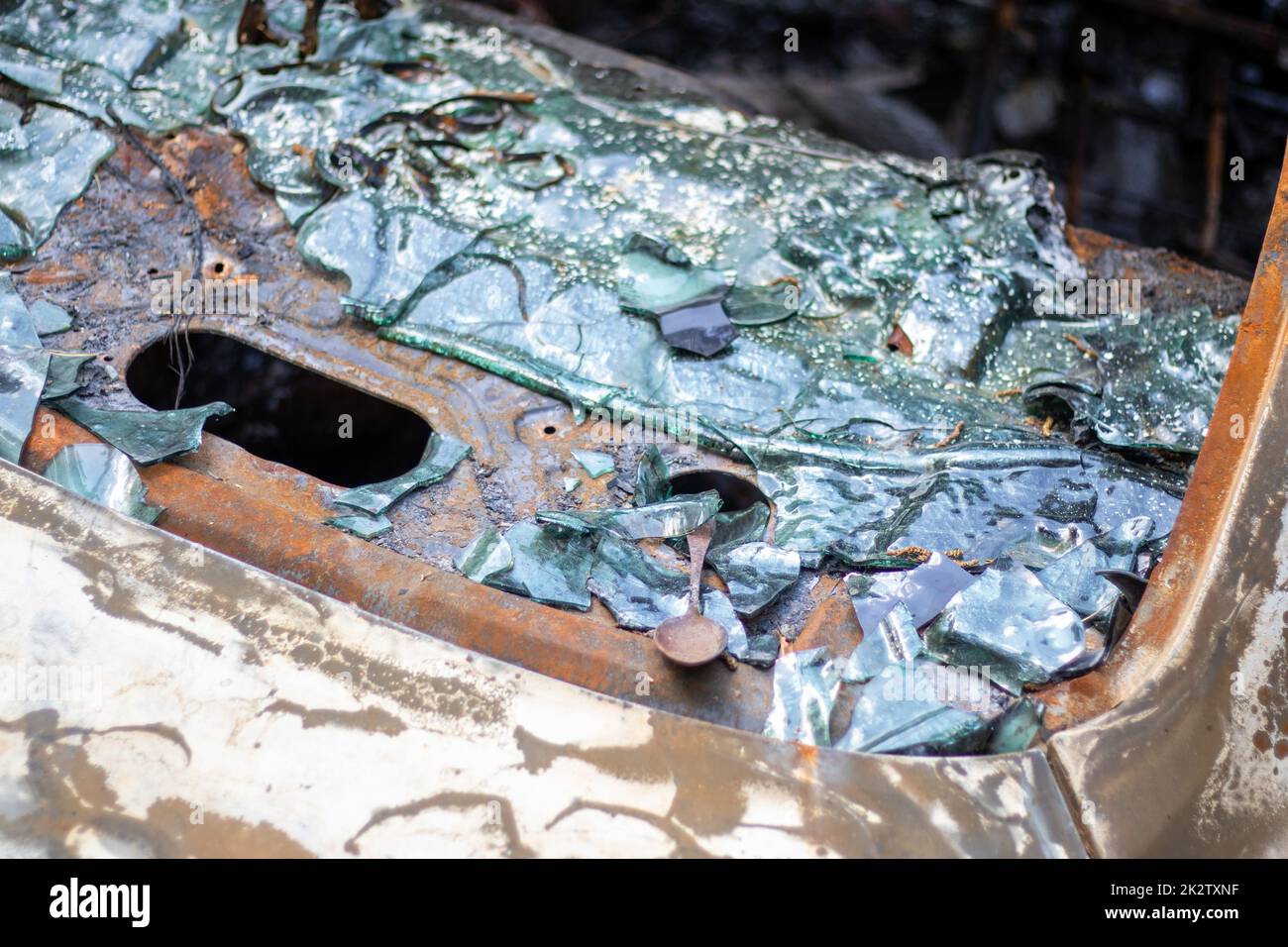 The car was completely destroyed by fire. Abandoned, burnt and rusty ...
