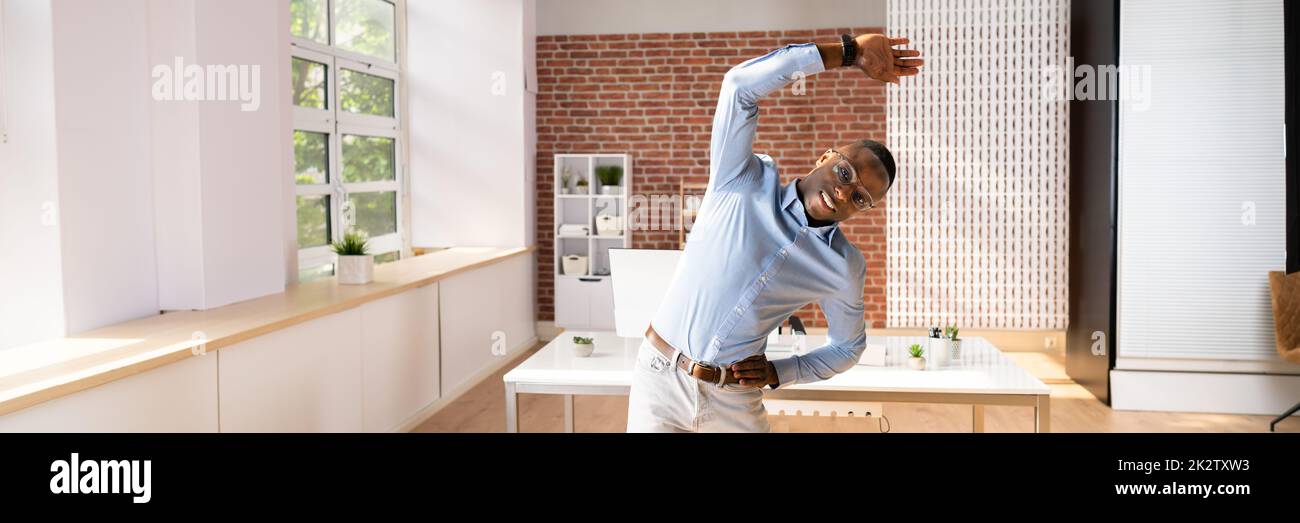 Businessman Doing Exercise Stock Photo
