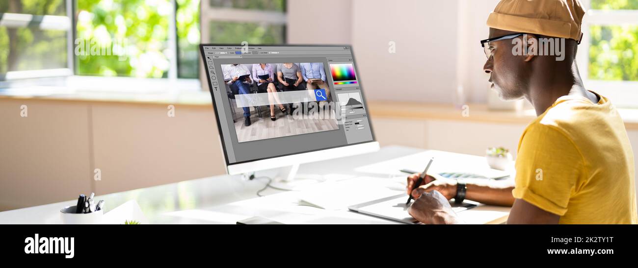 Designer Editing Photo On Computer In Office Stock Photo