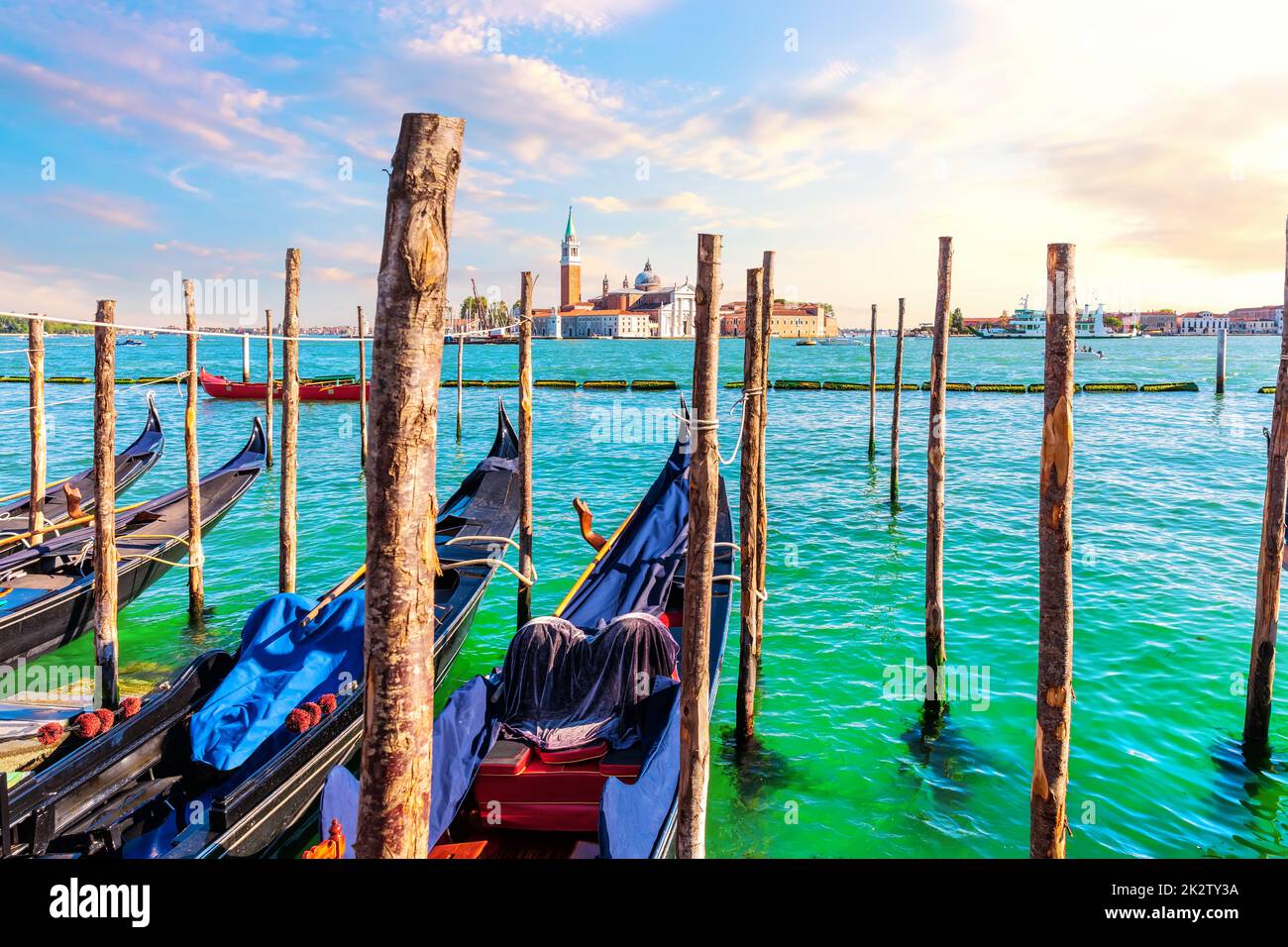 San Giorgio Maggiore Island and traditional Gondolas moored in the Grand Canal, Venice, Italy Stock Photo