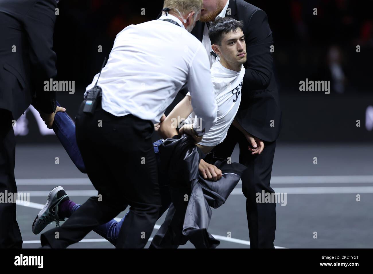 London, UK. 23rd Sep, 2022. 23rd September 2022; O2, London England: Laver Cup international tennis tournament: An environmental activist is dragged off court interrupting the match between Stefanos Tsitsipas and Diego Schwartzman Credit: Action Plus Sports Images/Alamy Live News Stock Photo
