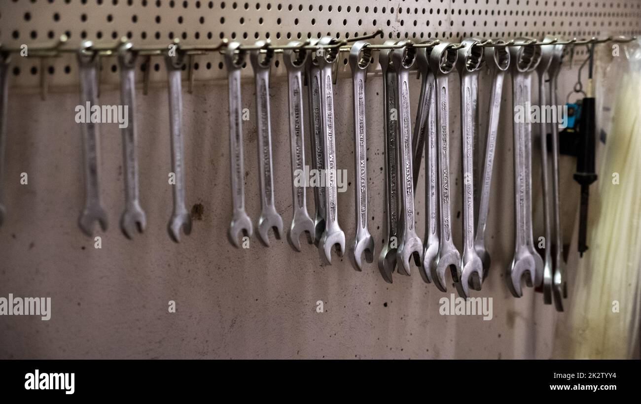 Garage tools hanging on the wall Stock Photo Alamy