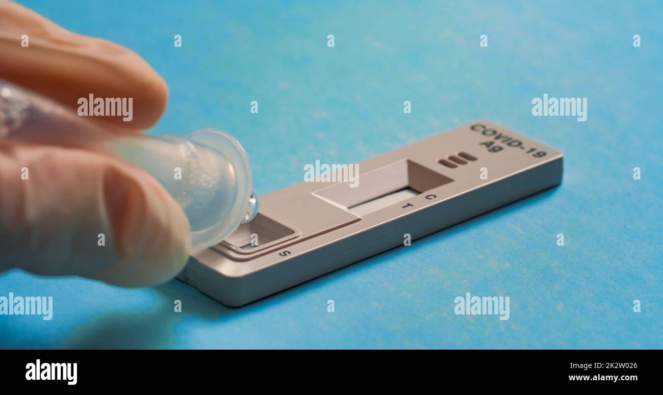 Adding drops to the details of the Covid19 Antigen Test Stock Photo Alamy