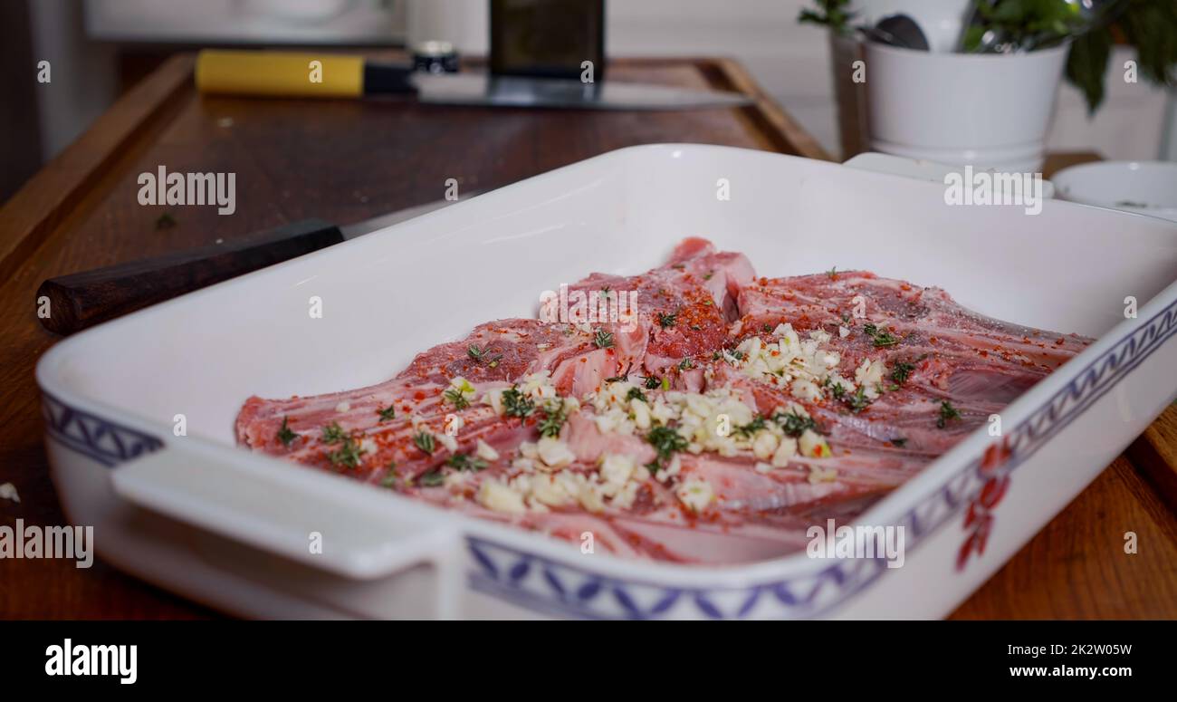 Lamb Meat Seasoned With Spices, Garlic, Herbs before Cooking. Juicy Raw