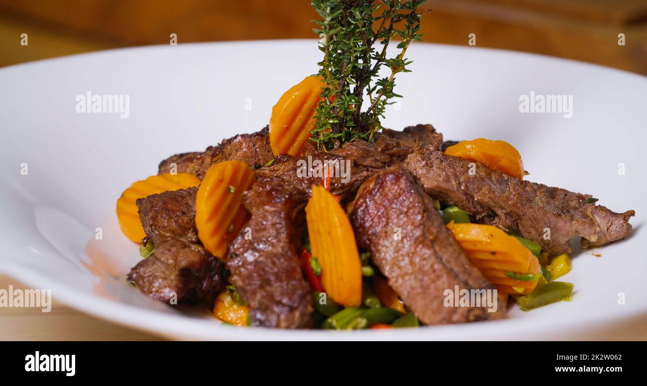 Beef Meal Presentation on White Plate Close Up. Chef Specialty Dish
