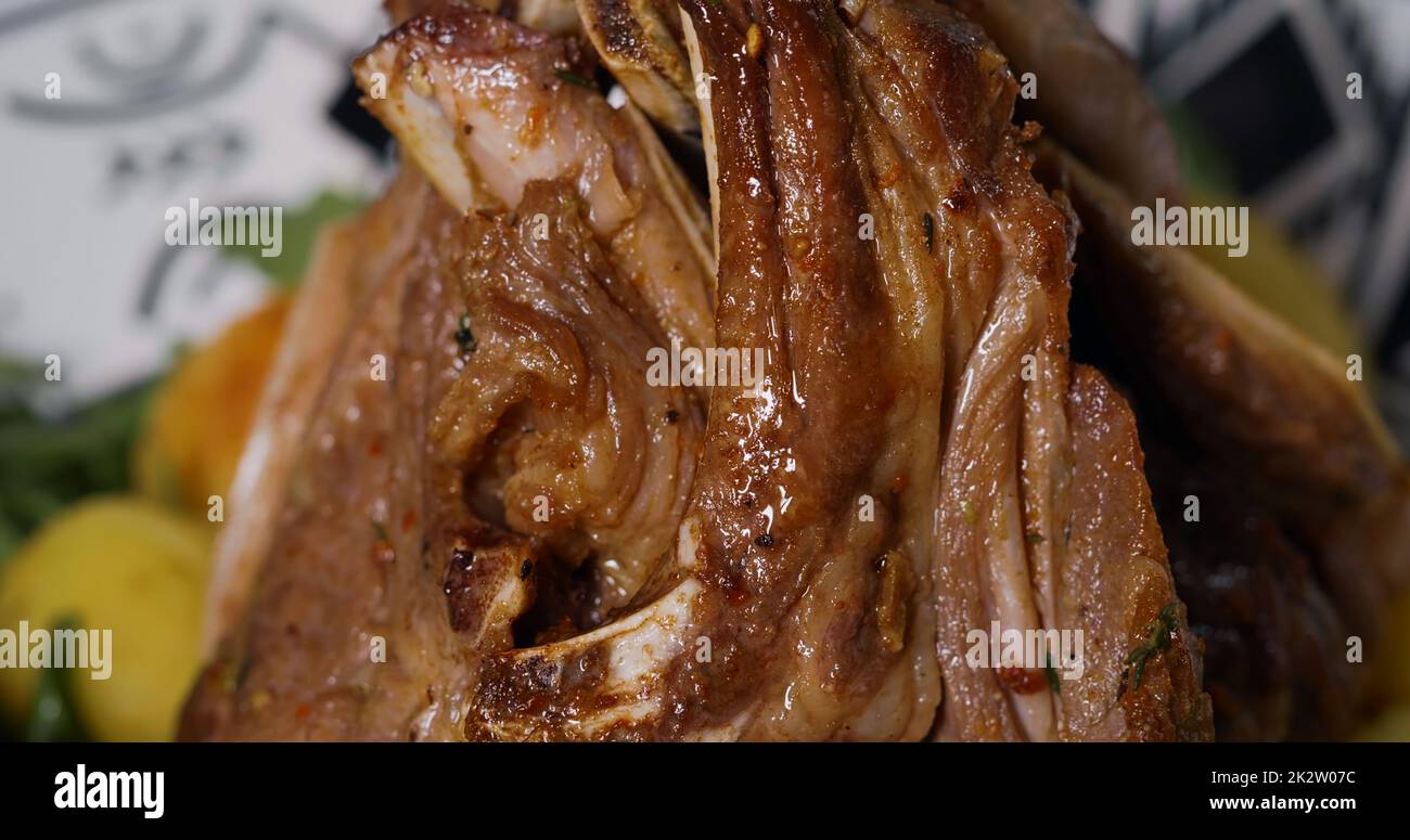 Appetizing Macro Cooked Meat. Juicy Tasty Lamb Ribs Dish. Stock Photo