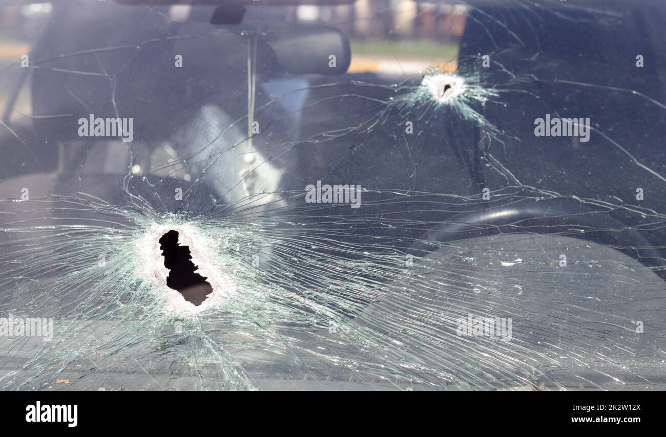 Windshield Gunshot Holes on the windshield of the car, it was shot from a firearm. Bullet ...