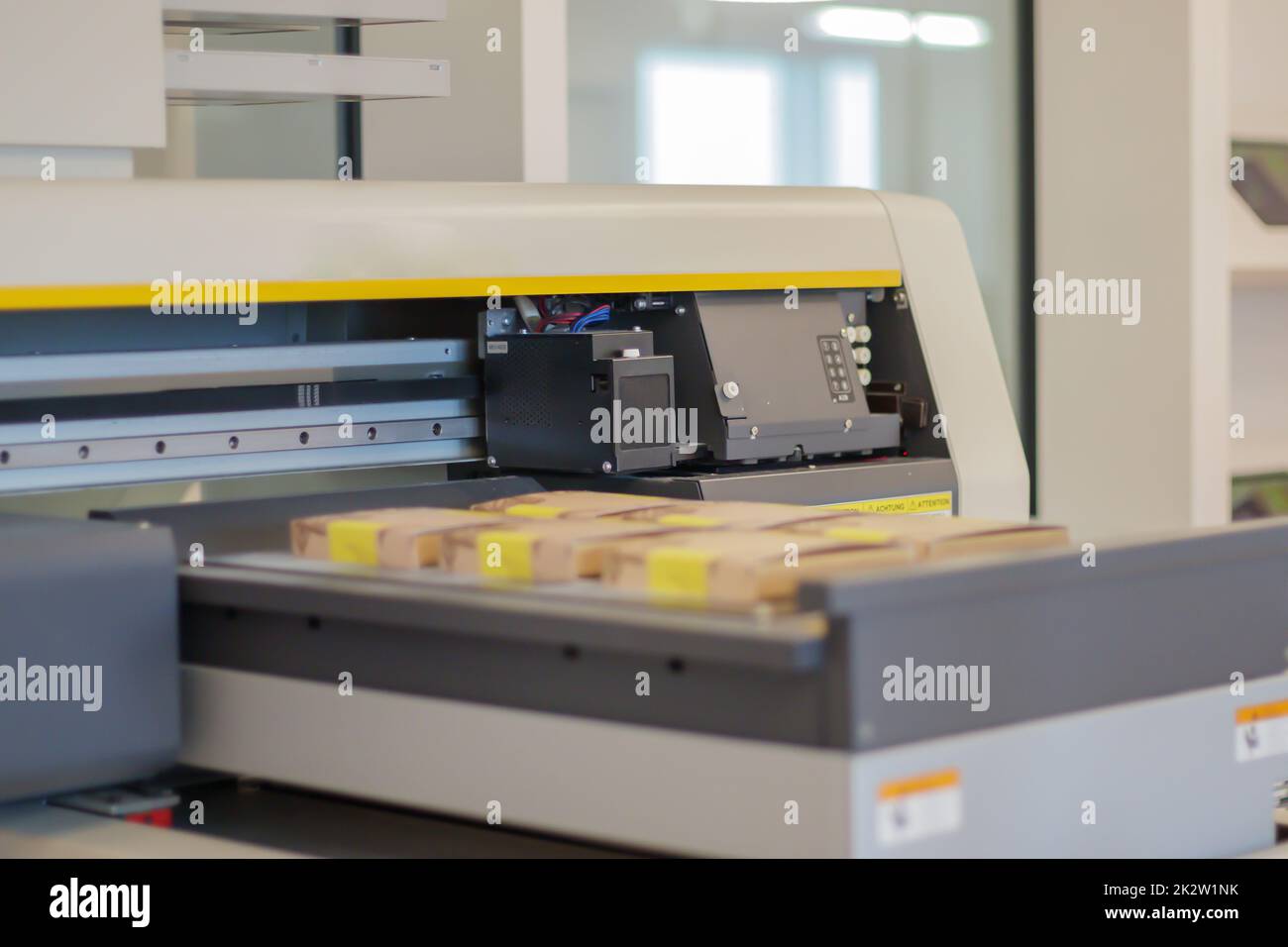 Printing machines in production. UV flatbed printer for printing on all solid materials. Large format inkjet printer control panel. Selective focus. Printing industry. Stock Photo
