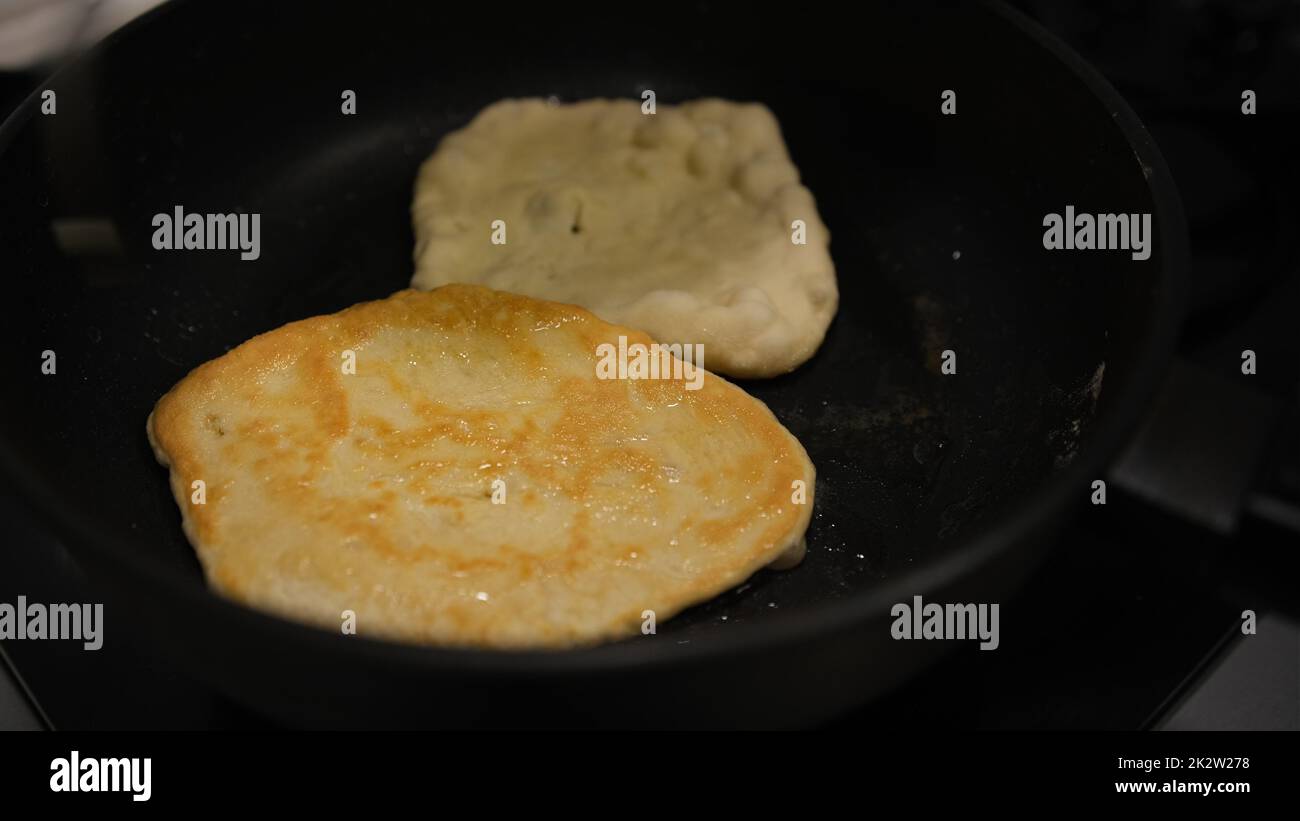 Homemade chapati flat pancakelike bread cooked on a griddle with oil