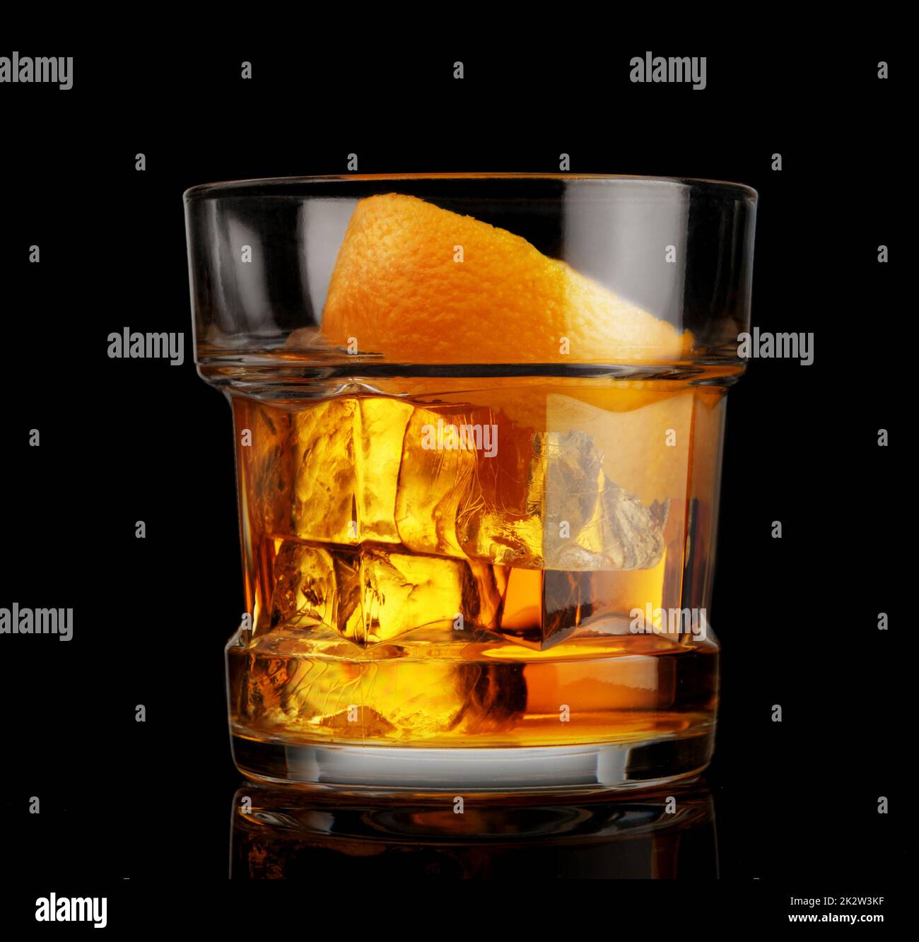 Glass of whiskey with ice and orange peel Stock Photo Alamy