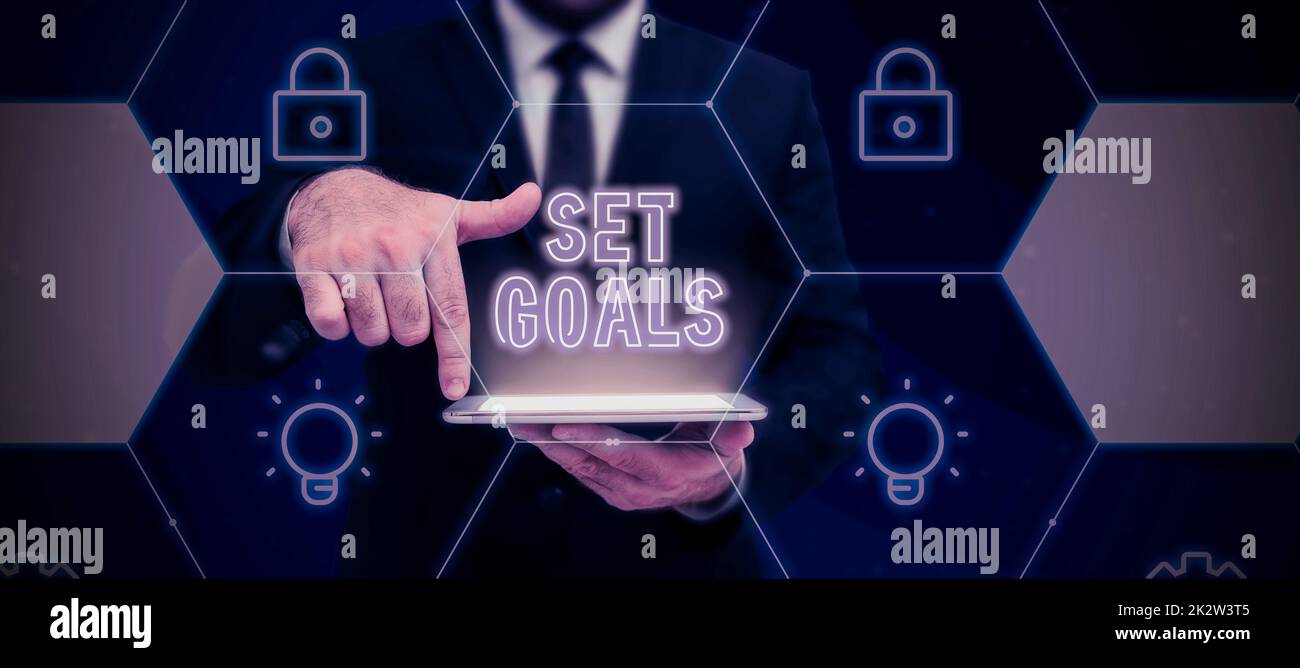 Text caption presenting Set Goals. Business overview Defining or achieving something in the future based on plan Lady in suit holding pen symbolizing successful teamwork accomplishments. Stock Photo