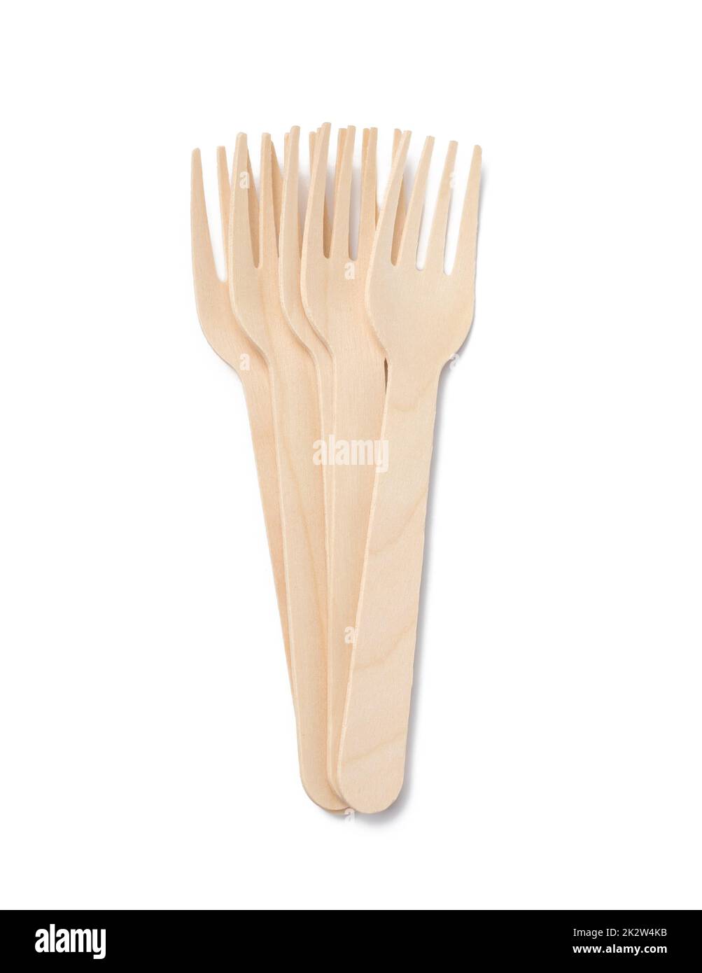 Wooden disposable brown forks on a white isolated background Stock Photo