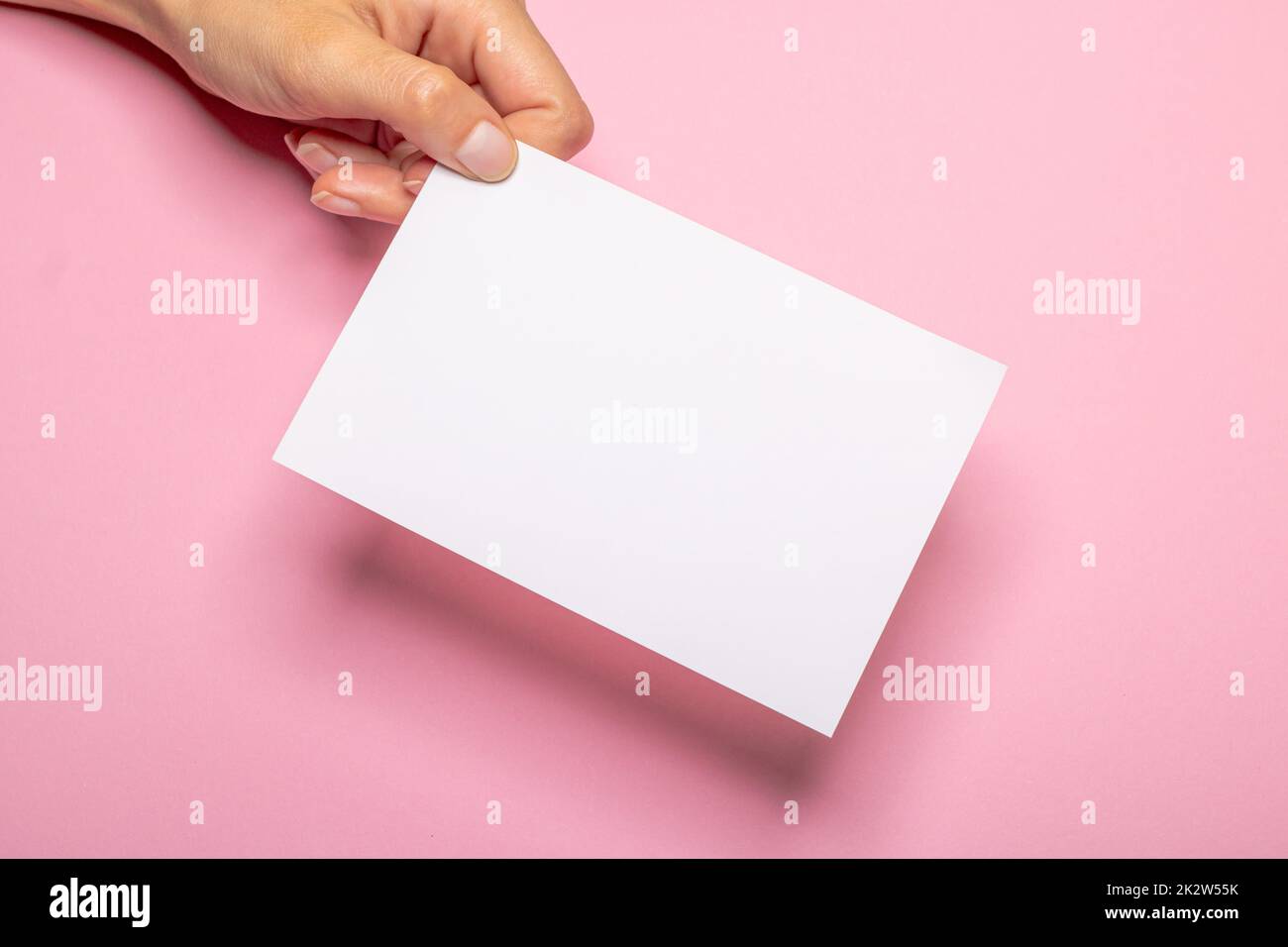 woman holding blank letter on Light Pink background Stock Photo Alamy