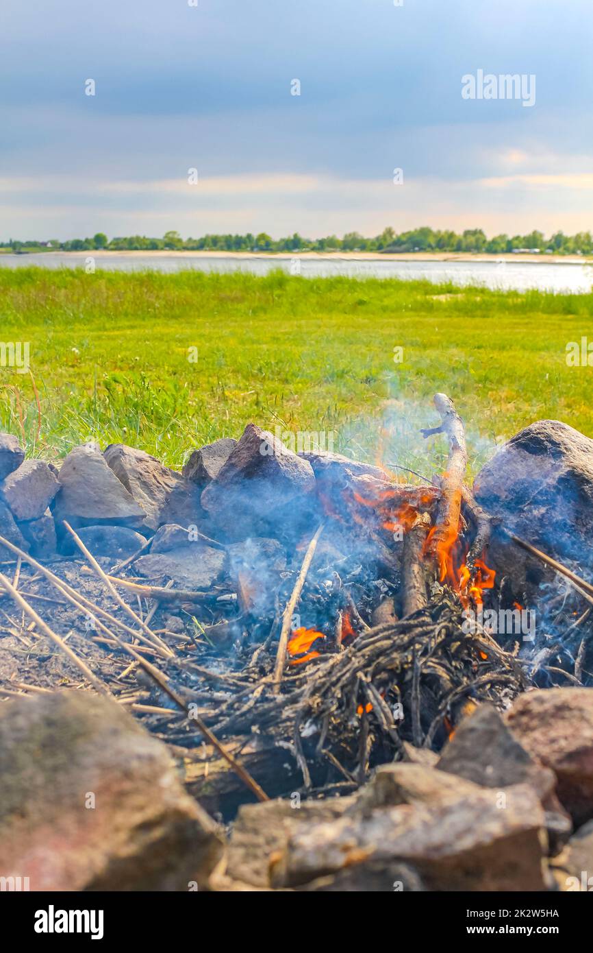 Campfire and burning wood with orange flames Germany Stock Photo - Alamy