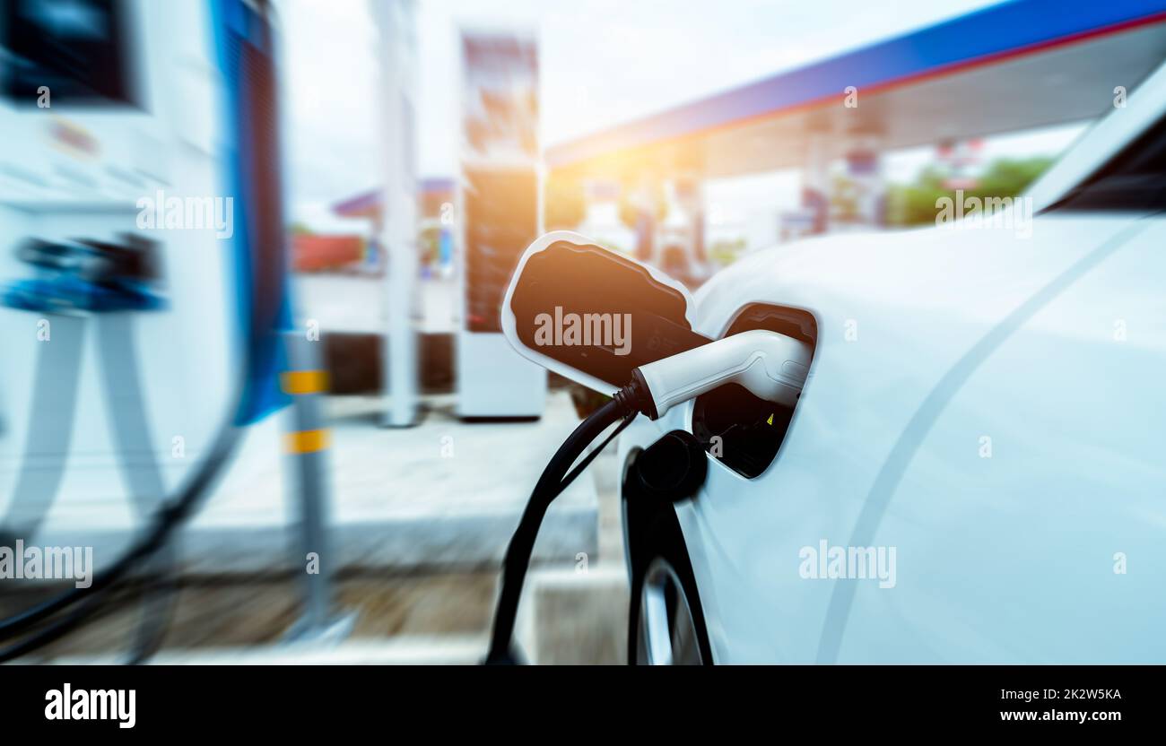 EV car charging at outdoor electric car charging station. EV car