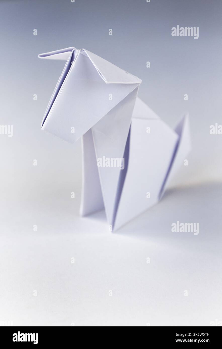 Paper dog origami isolated on a white background Stock Photo