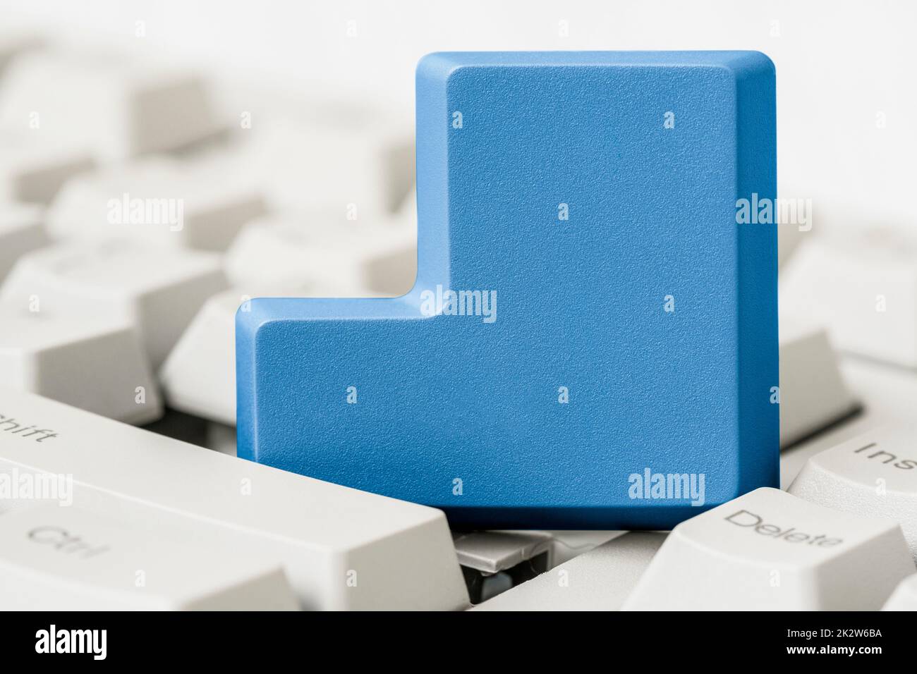 Empty blue button removed from computer keyboard Stock Photo